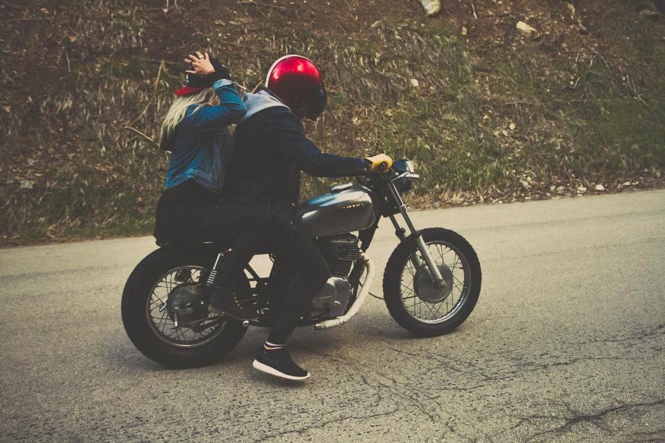 Motorcyclist riding a dark highway at night, illustrating catastrophic injury cases handled by Black Diamond Law