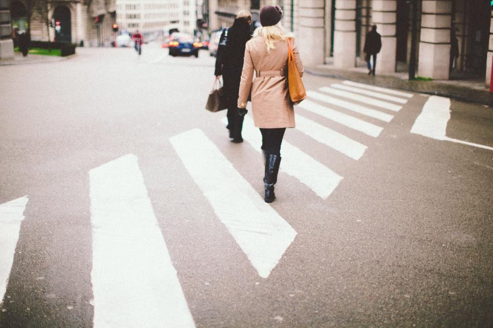 Empty city crosswalk at an urban intersection, representing pedestrian and bicycle accident claims