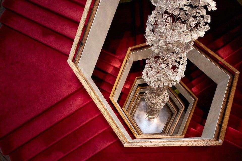 Marble hotel staircase in low light, representing premises liability claims against property owners and businesses